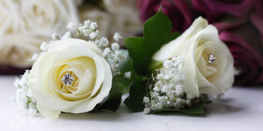Detail photo of two wedding buttonholes