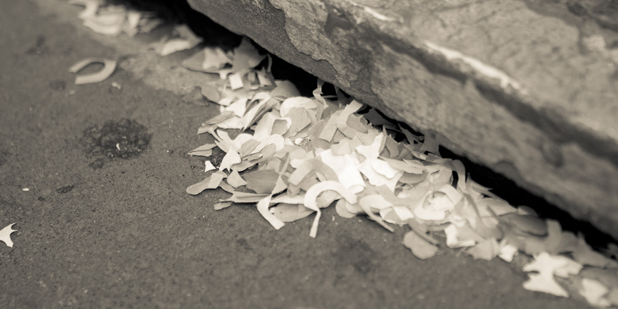 Artistic wedding photography of confetti in a gutter in Manchester